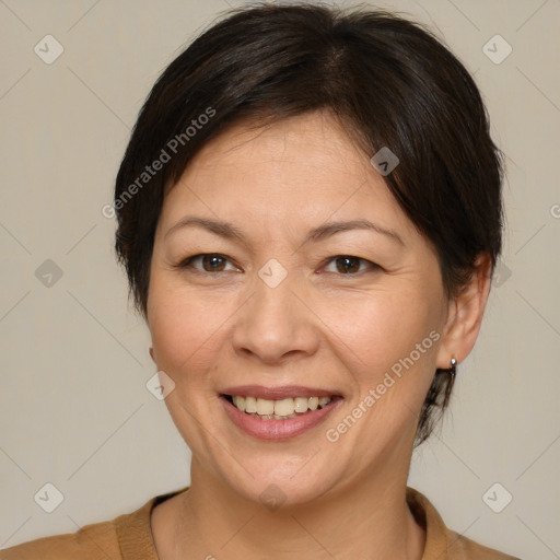 Joyful white adult female with medium  brown hair and brown eyes