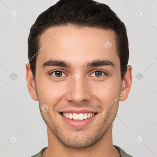 Joyful white young-adult male with short  brown hair and brown eyes