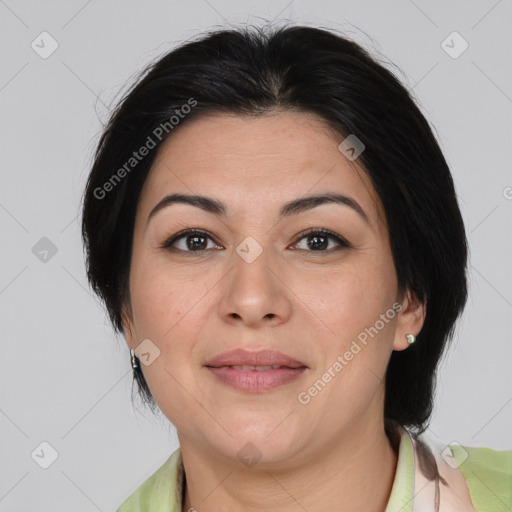 Joyful asian adult female with medium  brown hair and brown eyes