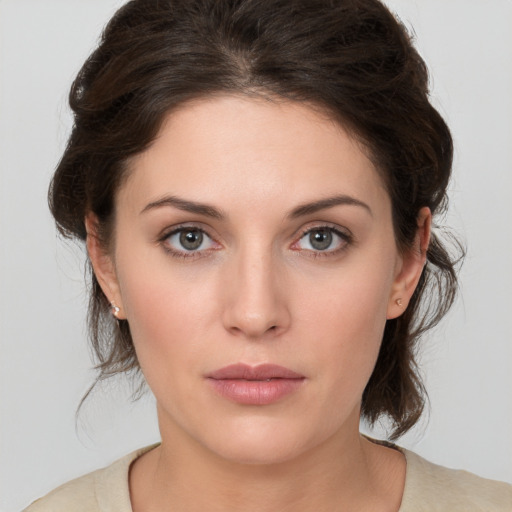 Neutral white young-adult female with medium  brown hair and brown eyes