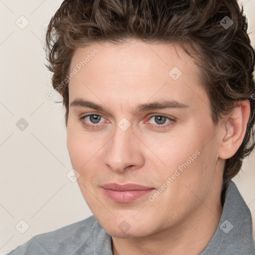 Joyful white young-adult male with medium  brown hair and brown eyes