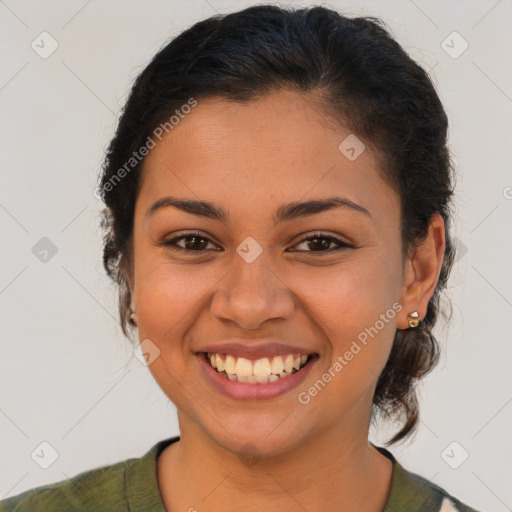 Joyful latino young-adult female with medium  brown hair and brown eyes