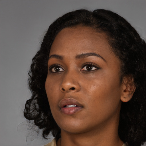 Neutral black young-adult female with long  black hair and brown eyes