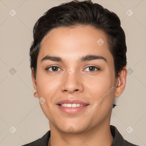 Joyful white young-adult male with short  black hair and brown eyes