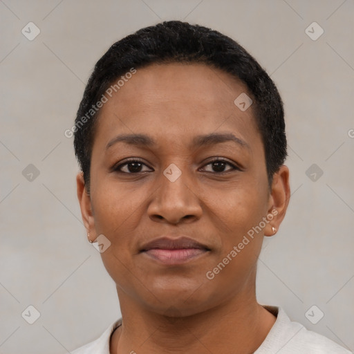 Joyful black young-adult female with short  black hair and brown eyes