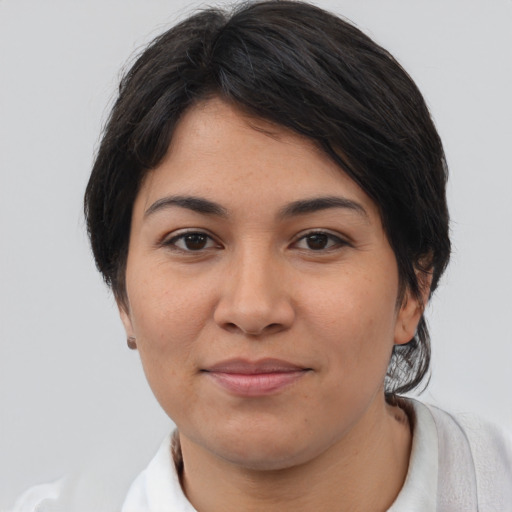 Joyful latino young-adult female with medium  black hair and brown eyes