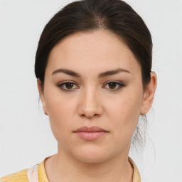 Neutral white young-adult female with medium  brown hair and brown eyes