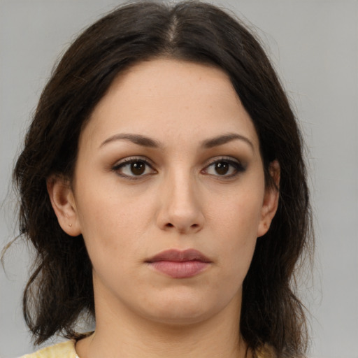 Neutral white young-adult female with medium  brown hair and brown eyes