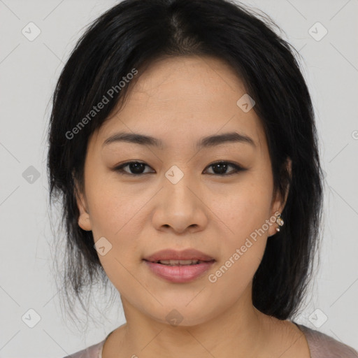 Joyful asian young-adult female with medium  black hair and brown eyes