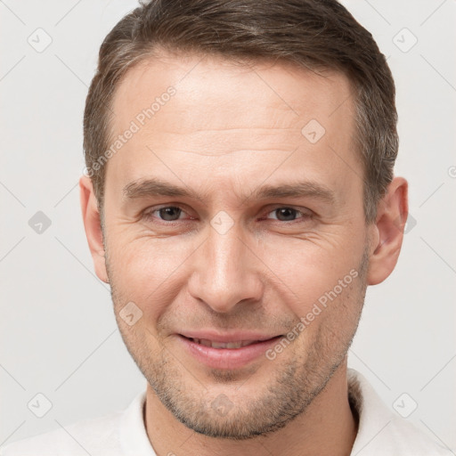 Joyful white young-adult male with short  brown hair and brown eyes