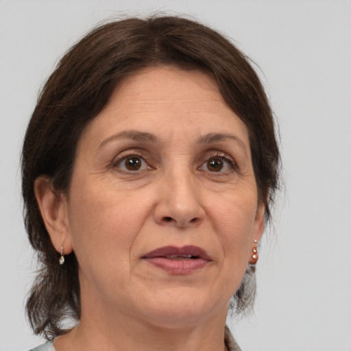 Joyful white adult female with medium  brown hair and brown eyes