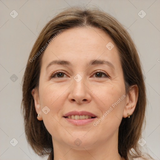 Joyful white adult female with medium  brown hair and brown eyes