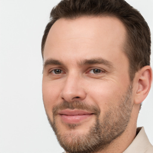 Joyful white young-adult male with short  brown hair and brown eyes