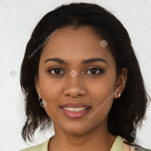 Joyful black young-adult female with medium  brown hair and brown eyes