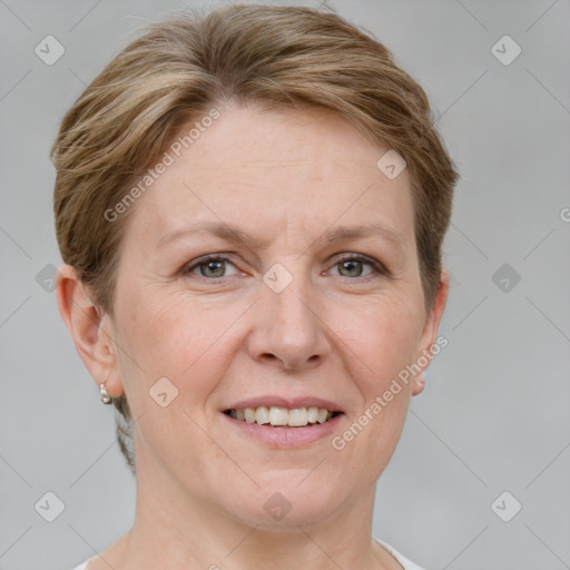 Joyful white adult female with short  brown hair and grey eyes