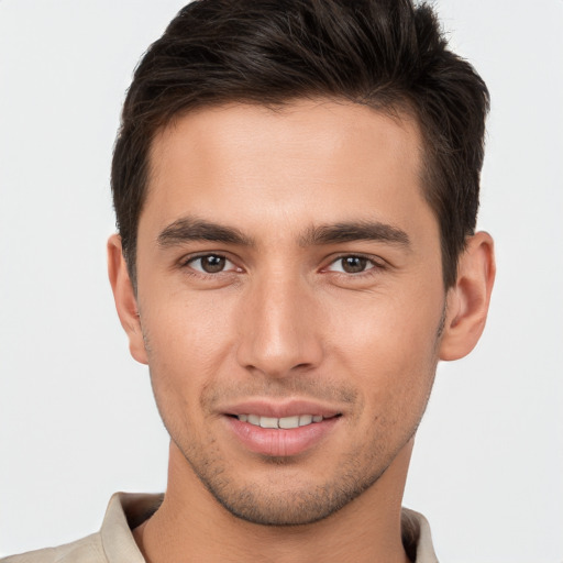 Joyful white young-adult male with short  brown hair and brown eyes