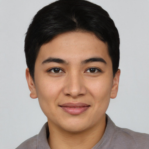 Joyful asian young-adult female with short  black hair and brown eyes