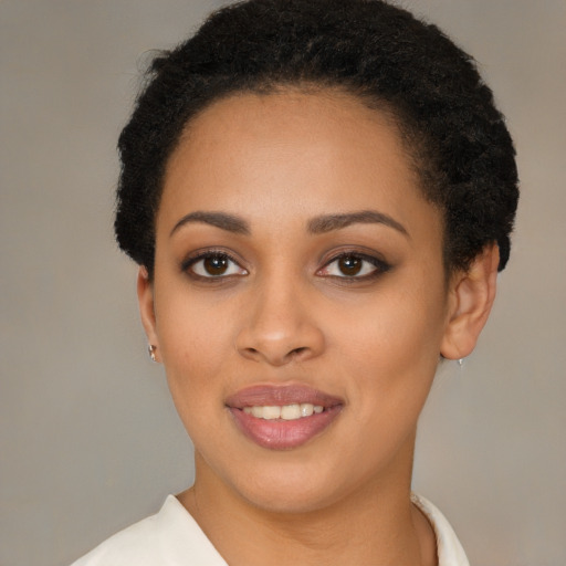 Joyful latino young-adult female with short  black hair and brown eyes