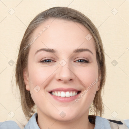 Joyful white young-adult female with medium  brown hair and blue eyes