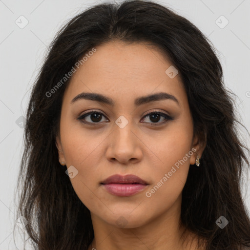 Joyful latino young-adult female with long  brown hair and brown eyes