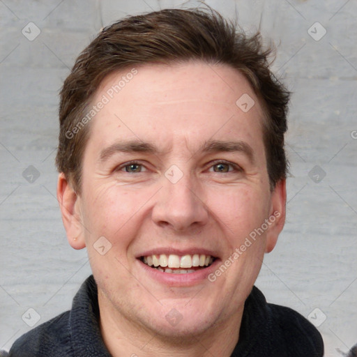 Joyful white adult male with short  brown hair and grey eyes