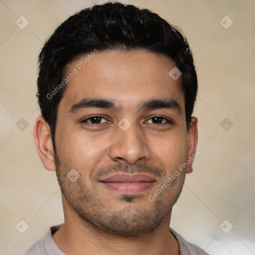 Joyful latino young-adult male with short  black hair and brown eyes