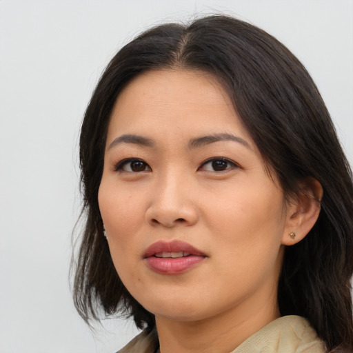 Joyful asian young-adult female with medium  brown hair and brown eyes