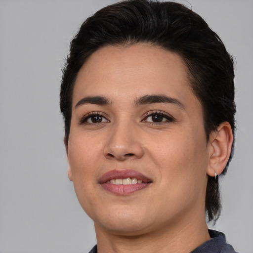 Joyful white young-adult female with medium  brown hair and brown eyes