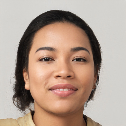 Joyful latino young-adult female with medium  black hair and brown eyes