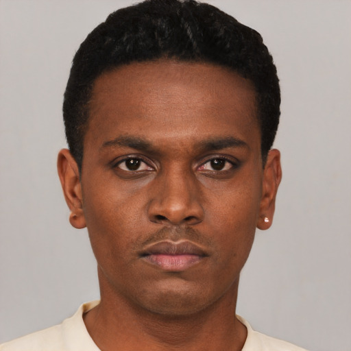 Neutral black young-adult male with short  black hair and brown eyes