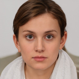 Neutral white young-adult female with short  brown hair and brown eyes