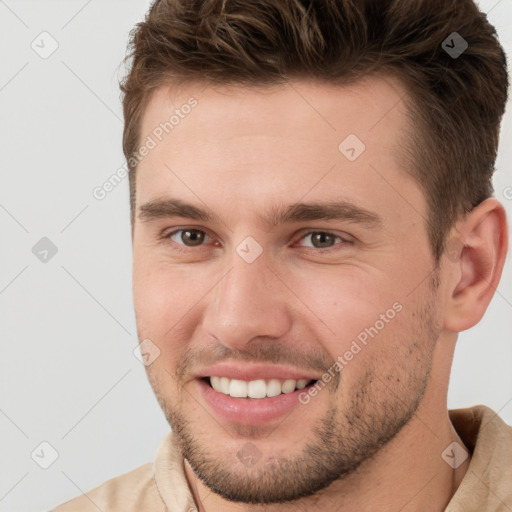 Joyful white young-adult male with short  brown hair and brown eyes