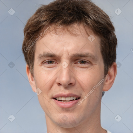 Joyful white adult male with short  brown hair and brown eyes