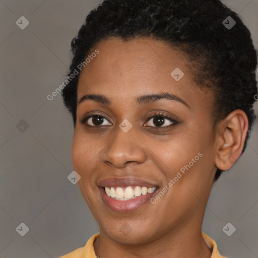 Joyful black young-adult female with short  brown hair and brown eyes