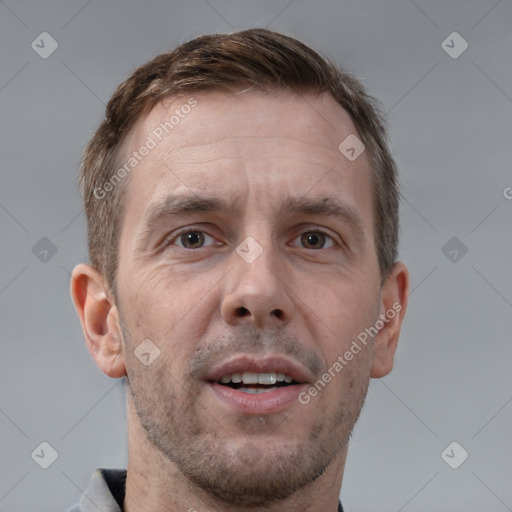 Joyful white adult male with short  brown hair and brown eyes