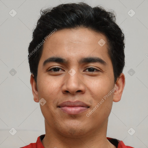 Joyful asian young-adult male with short  black hair and brown eyes