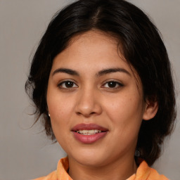 Joyful white young-adult female with medium  brown hair and brown eyes