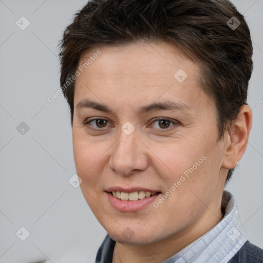 Joyful white adult female with short  brown hair and brown eyes