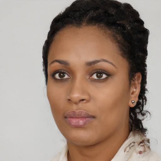 Neutral black young-adult female with medium  black hair and brown eyes