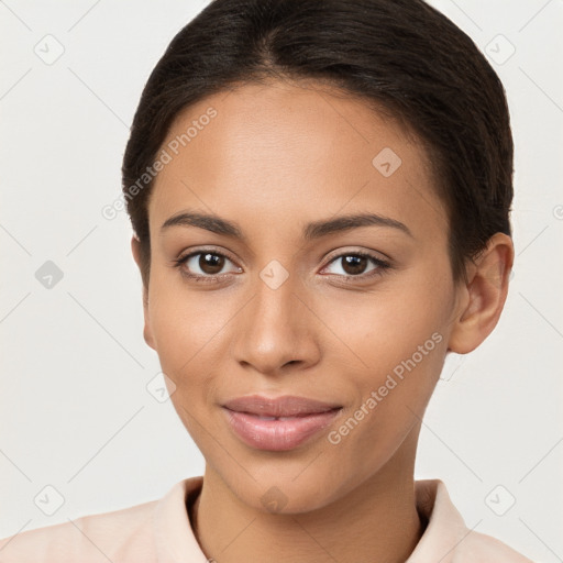 Joyful latino young-adult female with short  brown hair and brown eyes