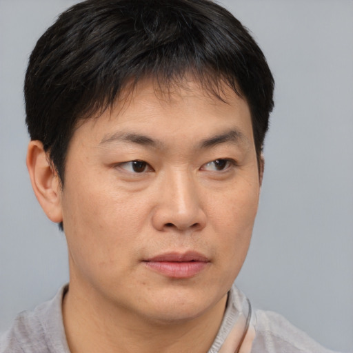Neutral asian young-adult male with short  brown hair and brown eyes