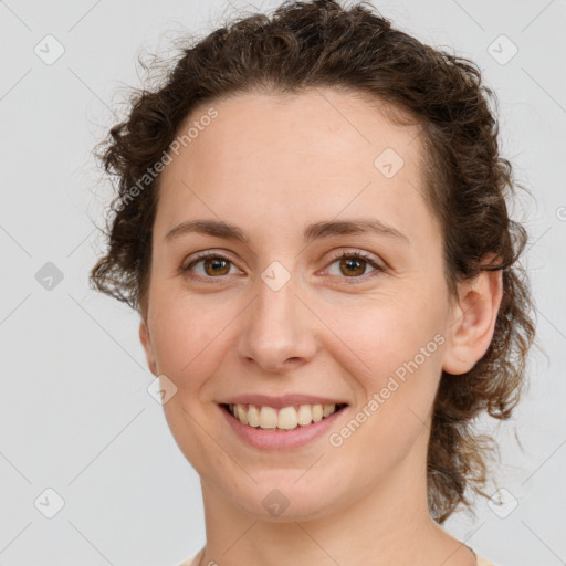 Joyful white young-adult female with medium  brown hair and green eyes