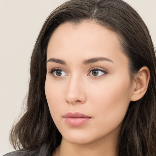 Neutral white young-adult female with long  brown hair and brown eyes