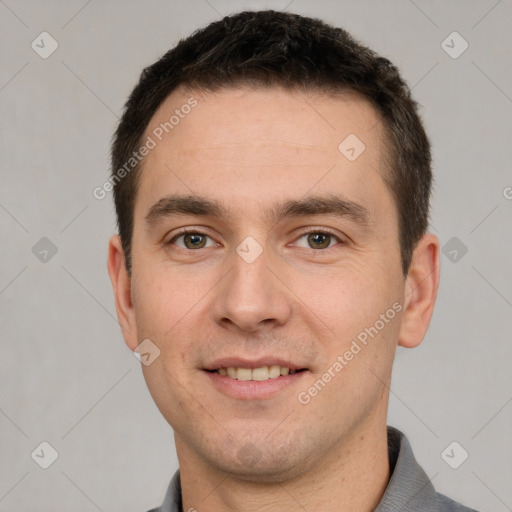 Joyful white young-adult male with short  brown hair and brown eyes