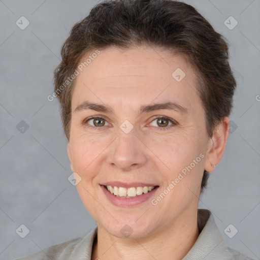 Joyful white adult female with short  brown hair and brown eyes