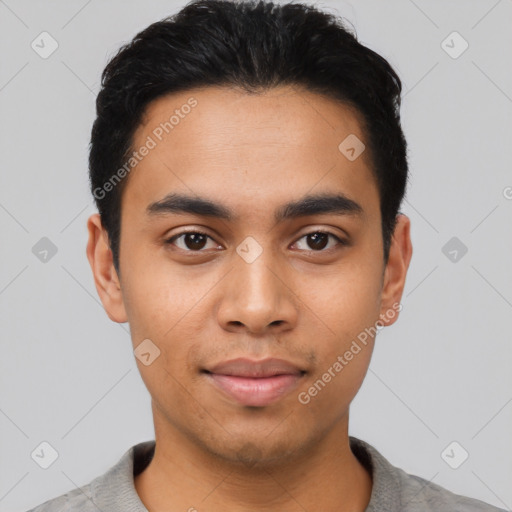 Joyful latino young-adult male with short  black hair and brown eyes