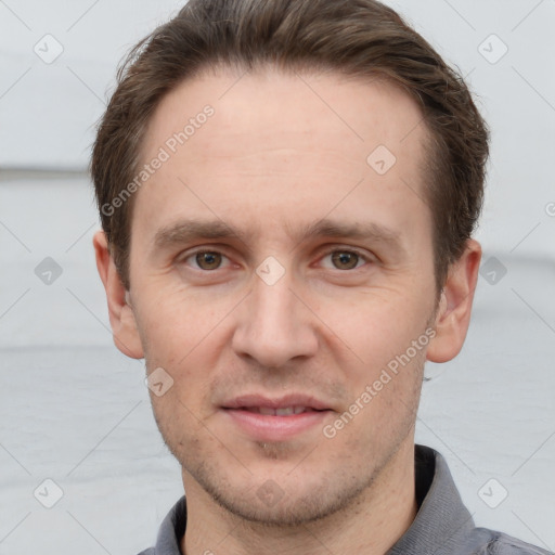 Joyful white adult male with short  brown hair and grey eyes