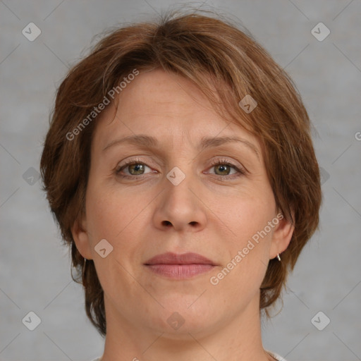 Joyful white adult female with medium  brown hair and green eyes