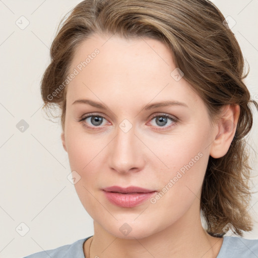 Joyful white young-adult female with medium  brown hair and blue eyes