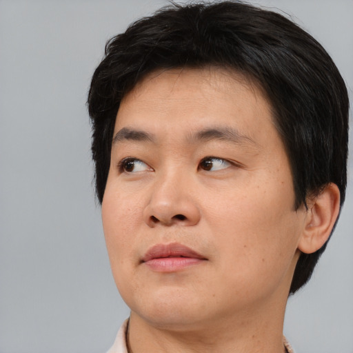 Neutral asian young-adult male with short  brown hair and brown eyes